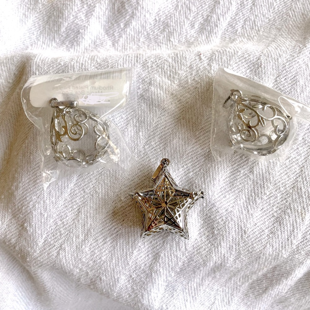 Set of 3 rhodium plated pendants that can hold cotton balls with essential oils
